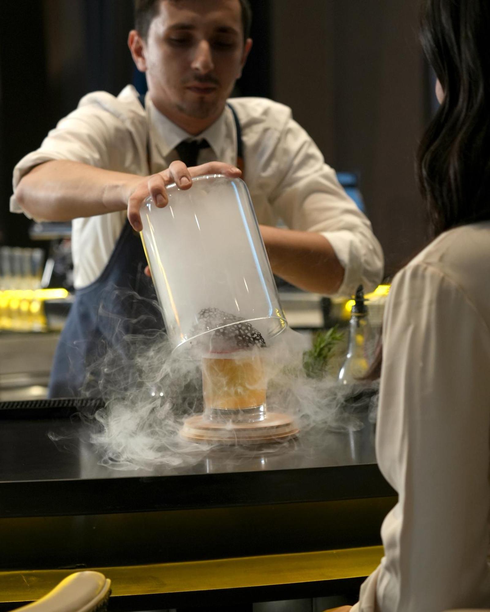 Fairmont Riyadh Eksteriør bilde A bartender preparing a cocktail with liquid nitrogen